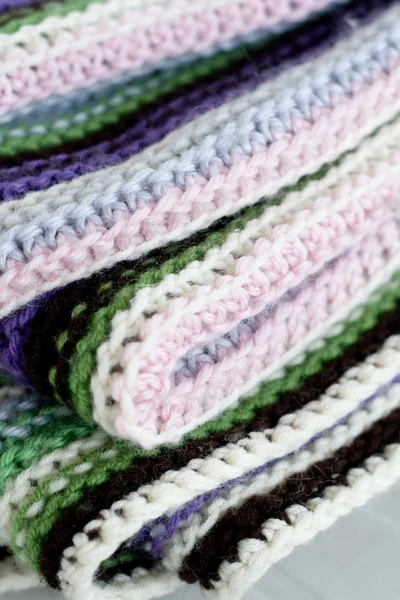 Knitting striped rug with white, purple, green and pink stripes — Stock Photo, Image