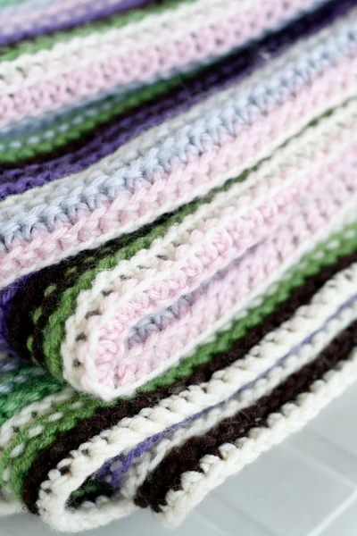 Knitting striped rug with white, purple, green and pink stripes — Stock Photo, Image