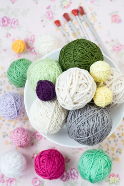 A lot of bright balls of knitting on the background — Stock Photo, Image