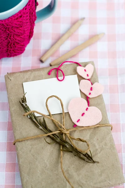 Old notebook with a dry branch of rosemary for love notes — Stock Photo, Image