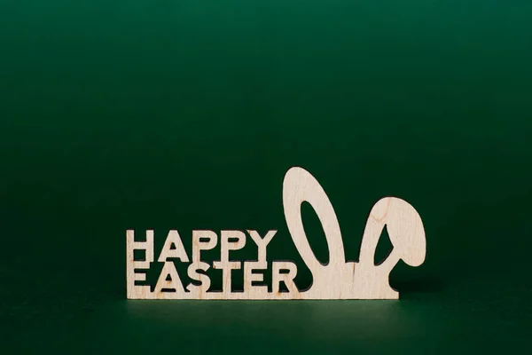 Wooden Inscription Happy Easterand Stylized Bunny Ears Dark Green Background — Stockfoto