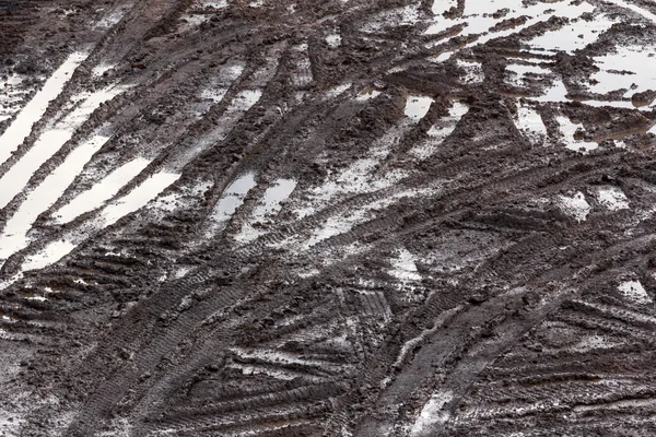 Tire tracks in the mud — Stock Photo, Image