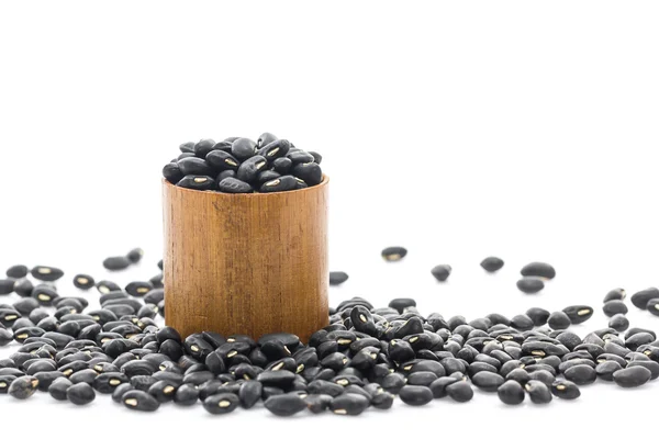 Black beans in wood cup — Stock Photo, Image