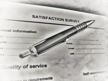 Pen laying on a customer satisfaction form clipart