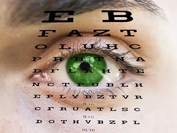 Eye test vision chart with man's face background — Stock Photo, Image