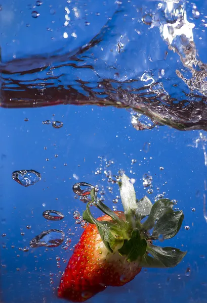 Strawberry dipped in water — Stock Photo, Image