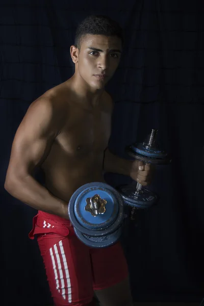 Young athlete with weight training — Stock Photo, Image