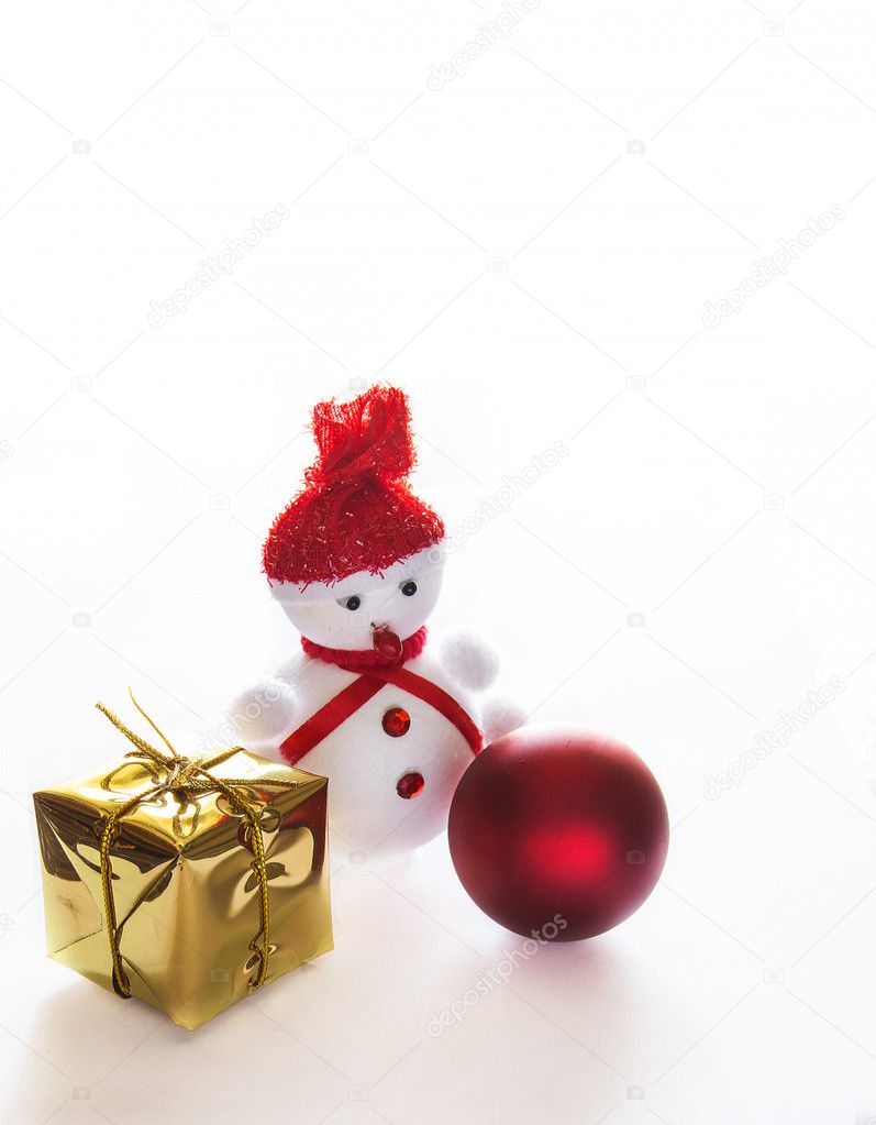 Snowman, package and Christmas ball on white background