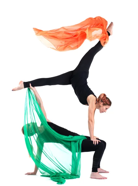 Two woman gymnast posing with flying fabric — Stock Photo, Image