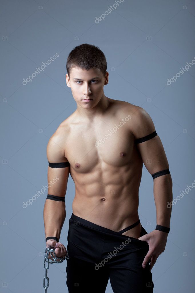 Athletic man dance striptease with chain — Stock Photo © Wisky #13317102