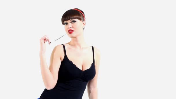 Woman in lingerie eat chewing gum and blow bubble — Stock Video