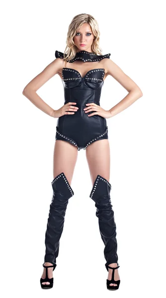 Sexy donna bionda in corsetto in pelle stand isolato — Foto Stock