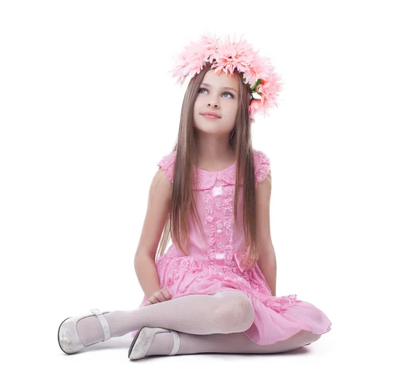 Little girl in pink dress and wreath sitting — Stock Photo, Image