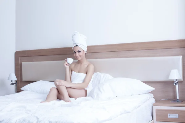 Brunette woman wearing towels on her body — Stok fotoğraf