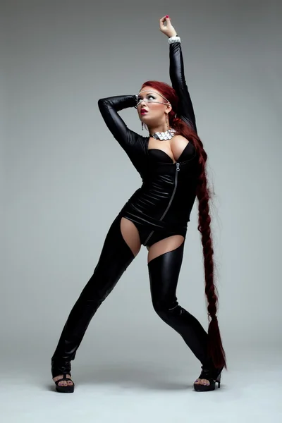 Junge Frau im sexy Kostüm mit Schalter — Stockfoto