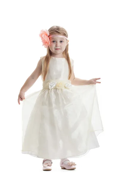 Little girl in beige dress — Stock Photo, Image