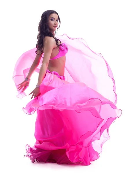 Dancer in pink costume performing oriental dance Royalty Free Stock Photos