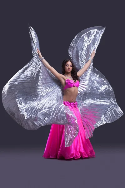 Dancer performing oriental dance with wings — Stock Photo, Image