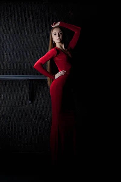 Pretty woman in red long dress - night club — Stock Photo, Image