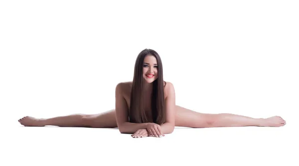 Bastante joven mujer desnuda haciendo split aislado — Foto de Stock