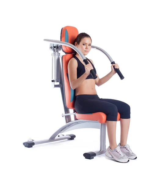 Beauty woman sitting on exerciser — Stock Photo, Image