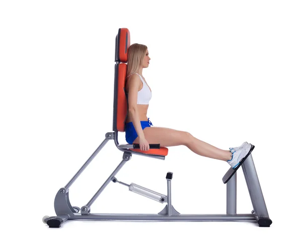 Blonde woman sitting on isodynamic exerciser — Stock Photo, Image