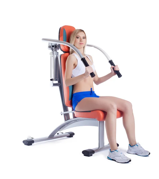 Kvinna sitter på hydrauliska exerciser isolerade — Stockfoto
