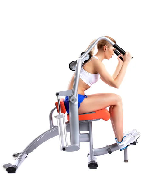 Mulher magro no exercitador isodinâmico — Fotografia de Stock