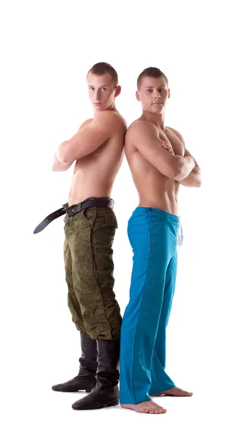 Dos hombres musculosos posando en uniforme — Foto de Stock