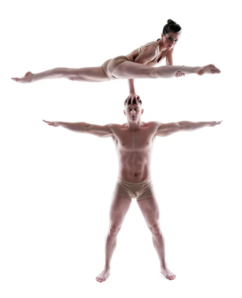 Two flexible gymnasts posing in studio — Stock Photo, Image