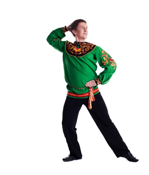 Cheerful man performing folk dance in studio — Stock Photo, Image