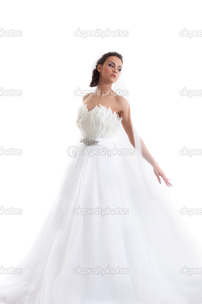 Young beautiful bride posing in fashionable dress
