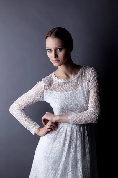 Portrait of fragile young girl in white lace dress — Stock Photo, Image