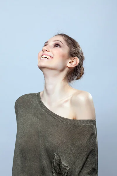 Beautiful woman laughing in studio — Stock Photo, Image