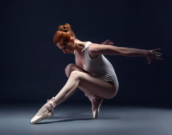 Graceful slender ballerina dancing in studio — Stock Photo, Image