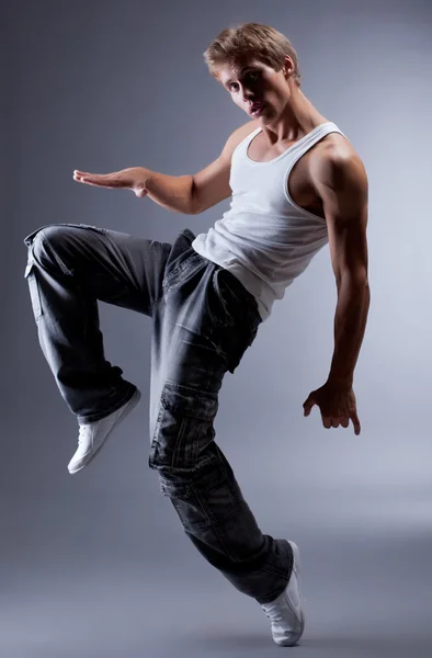 Emotional modern performer dancing in studio — Stock Photo, Image