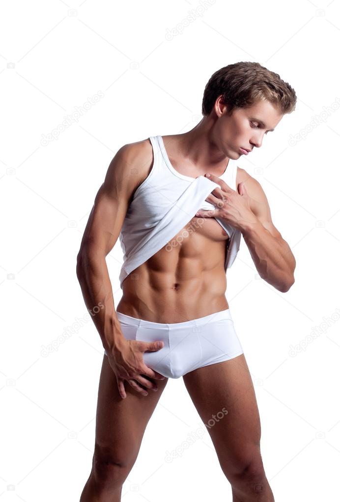 Naked Bodybuilder Posing While Doing Push-ups Stock Photo
