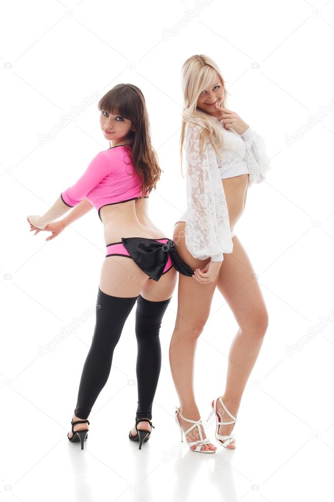 Sexy smiling girls posing in erotic costumes