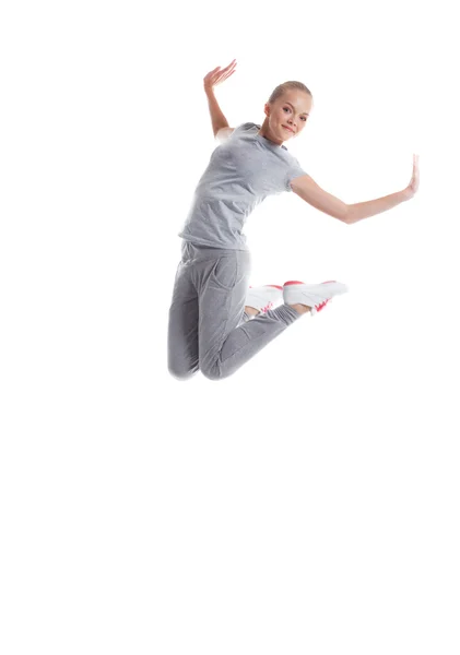 Image of smiling sporty girl jumping in studio — Zdjęcie stockowe