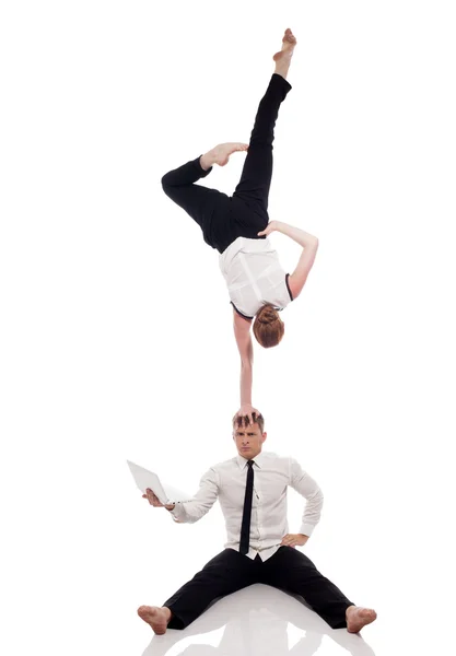 Idea of multitasking - businessmen-gymnasts — Stock Photo, Image