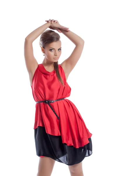 Graceful young girl posing in satin red dress — Stock Photo, Image