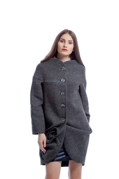 Beautiful brunette posing in gray woolen coat — Stock Photo, Image