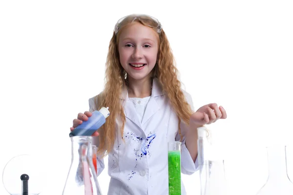 Smiling girl posing with test-tubes in studio — Stock Photo, Image