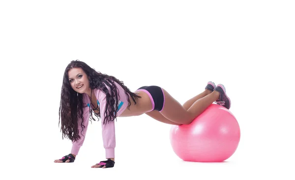 Smiling athletic woman posing with pink sport ball — Stock Photo, Image