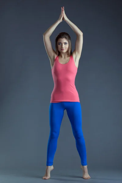 Charming slim brunette practicing yoga in studio — Stock Photo, Image