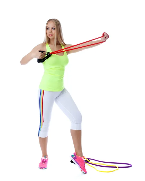 Pretty girl exercising with gymnastic simulator — Stock Photo, Image