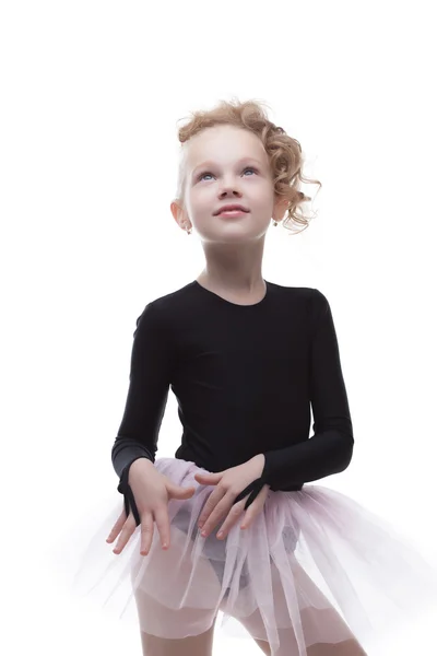 Portrait of cute little ballerina looking up Stock Picture