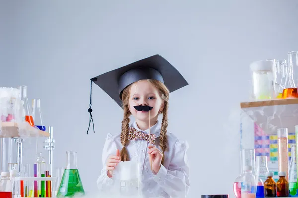 Merry little scientist posing with fake mustache — Stock Photo, Image