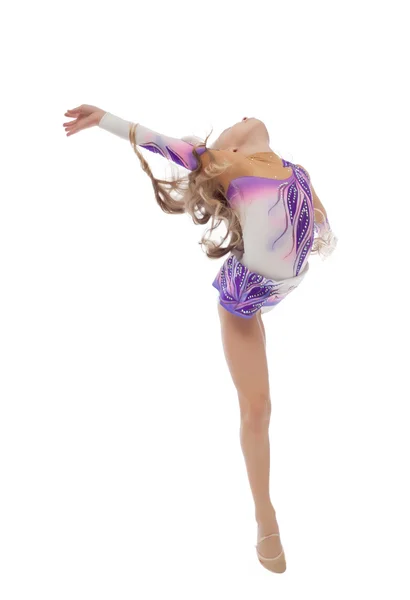 Flexibla söt liten gymnast poserar i studio — Stockfoto