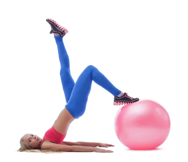 Model doing stretching exercises with fitness ball — Stock Photo, Image